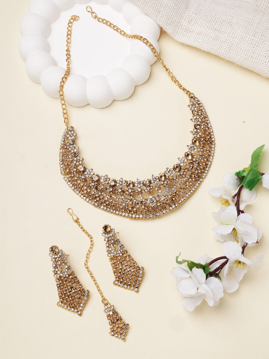 Traditional stone studded and gold-plated heavy jewellery set
