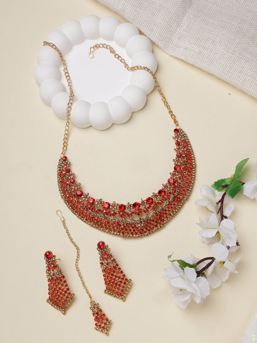 Traditional stone studded and gold-plated heavy jewellery set